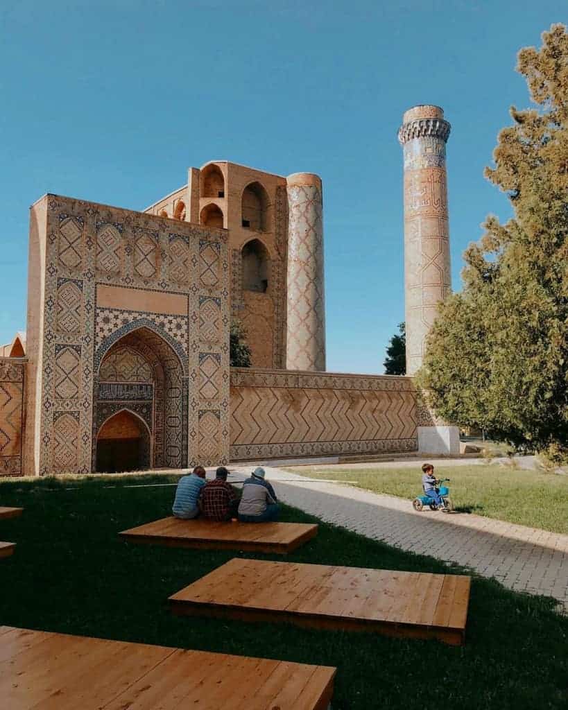 Local men sit outside the Bibi Khanum mosque in Samarkand