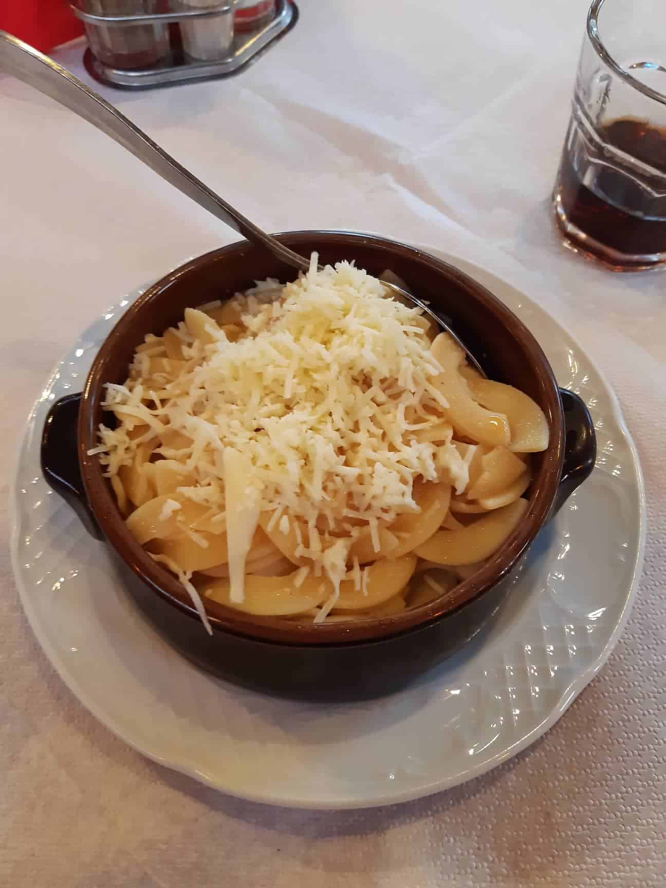 Sampling the local food: homemade pasta with smoked metsovone cheese