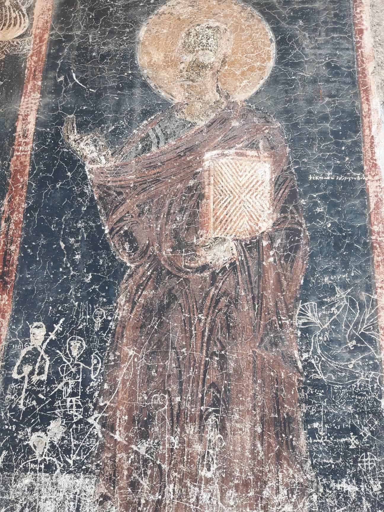 Worn Byzantine frescoes in ancient churches. The eyes were scratched out during the Ottoman occupation. 