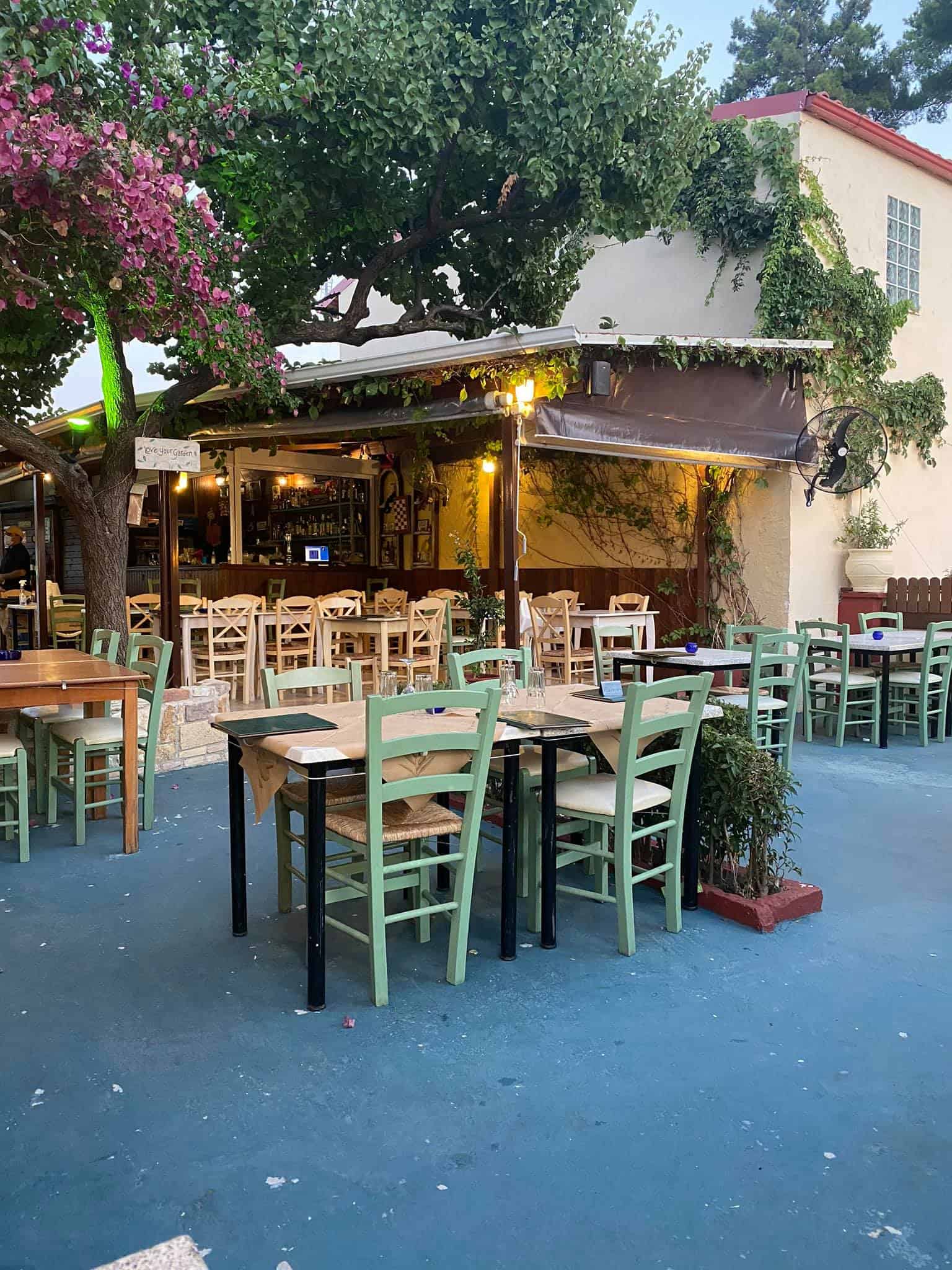 An inviting outdoor space of a restaurant with tables and chairs