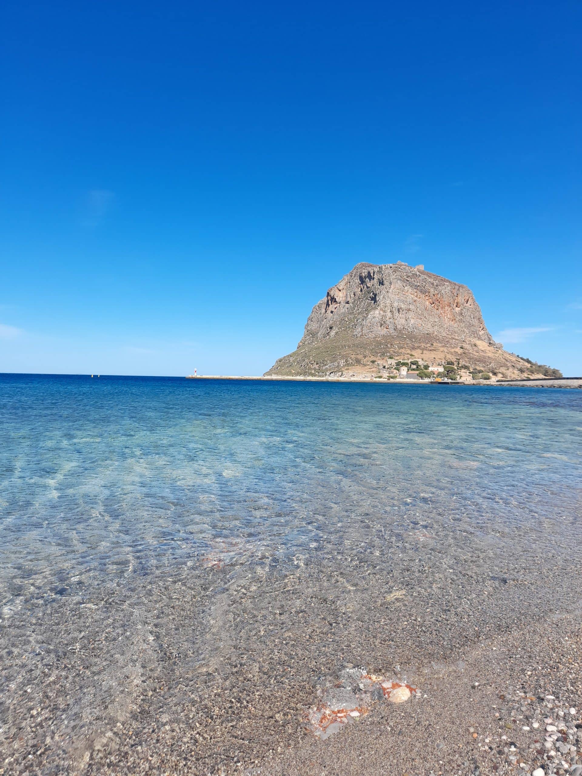 Clear turquoise waters surround Monemvasia