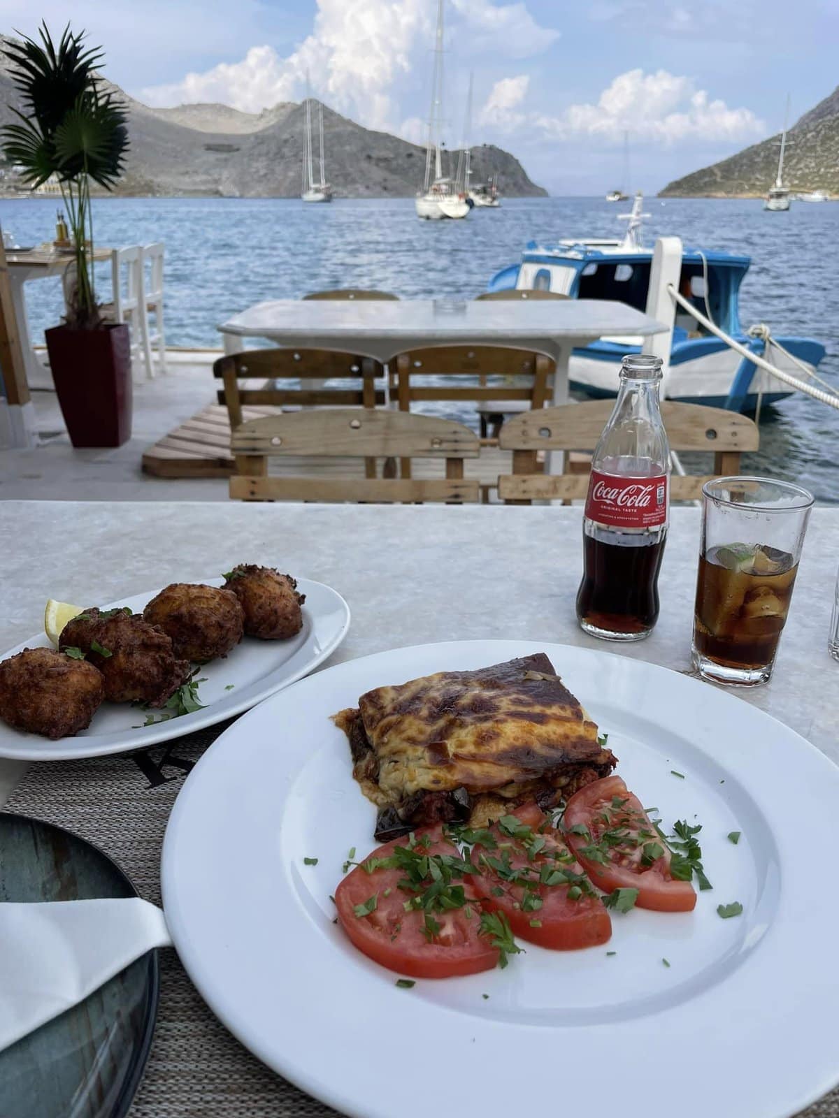 Enjoying moussaka with a view in Symi